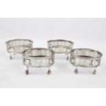 A set of four Silver George III oval salts with pierced sides and claw feet - 3.5" long - London