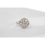 Fine 18ct White Gold Ladies Diamond cluster ring, Central Brilliant Cut Diamond in rub over