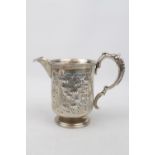 A Victorian cream jug with engraved decoration, Birmingham 1870 by George Unite with later spout