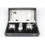 Silver cruet set each on pad feet, Birmingham 1955. 116g total weight excluding Blue glass liners in