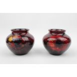 Pair of Moorcroft Peony Flambe Squat vases 7cm in Height with impressed mark and signature to base