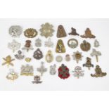 Military cap badges of various regiments (aprox 32)