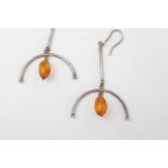 2 Silver Set Amber Pendants of oval form 5g total weight