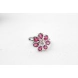 Ladies 18ct White Gold Ruby & Diamond Floral design ring, with central Brilliant cut Rub over