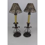 Pair of 19thC Regency style candelabras of oval harp form with later middle fitting and under pieced