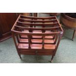 20thC Mahogany Canterbury of 4 sections over 2 drawers, supported on brass casters