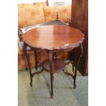 Edwardian Mahogany Shaped top window table with carved slender legs and under tier. 75cm in Diameter