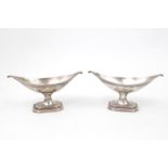 Good Pair of Victorian Silver boat shaped salts on octagonal bases with outstretched scroll