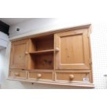 Pine Wall cabinet of shelf unit flanked by 2 cupboards over 3 drawer base. 98cm in Width