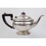George V Silver Teapot of Circular form with simple beaded decoration over rimmed foot circular
