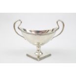 An American Georgian style two handle bowl on diamond shaped pedestal base by Mauser Manufacturing