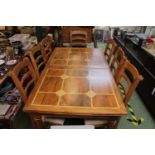 Good quality Inlaid dining table with extra leaf and a set of 8 matching chairs with upholstered