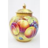 A Royal Worcester painted fruit ginger jar and cover decorated with peaches and grapes, 18cm high,