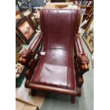 Heavily carved Late Victorian Gothic Elbow chair with lions lead handles