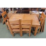 Modern French Oak extending dining table of 2 leaves with a set of 4 dining chairs