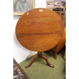 19thC Circular Mahogany tilt top wine table with turned stem and tripod support. 75cm in Diameter