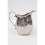 Heavy George V cream jug with engraved shield and greyhound cartouche. Birmingham 1912 by