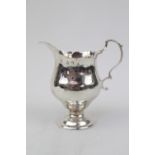 A George II Silver cream jug of baluster form on spreading base, London 1770 probably by Nathaniel