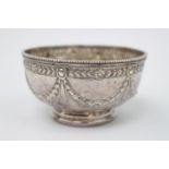 A Victorian Silver sugar bowl decorated with embossed swags, 10cm in Diameter London 1874 by Henry