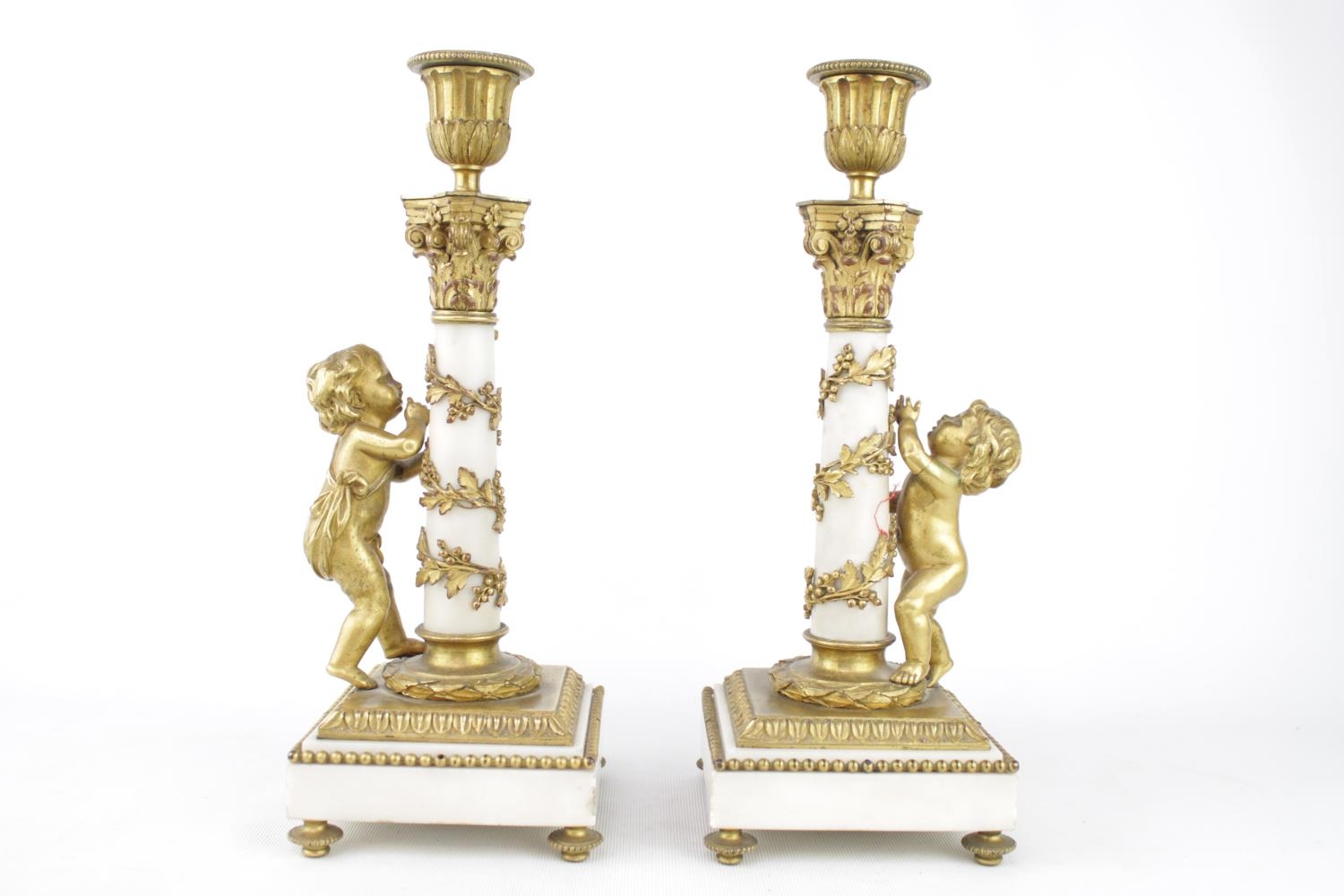 Pair of 19th century Louis XVI candlesticks of white Carrara marble and Ormolu design. 30cm in