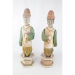 Pair of Antique Chinese green and amber lead-glazed pottery funerary figures in the form of