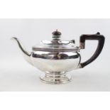 George V Silver Teapot of Circular form with simple beaded decoration over rimmed foot circular