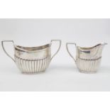 Victorian Silver matching Sugar bowl and Cream jug of fluted design on rimmed foot, engraved