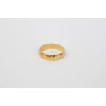 Ladies Yellow metal Shaped wedding band tests as 18ct. Size S. 6.4g total weight