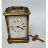 Good quality French Brass carriage clock with Roamn numeral dial and double ended key