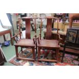 Pair of Chinese Hardwood Elbow chairs with cane woven seats over simple stretchers