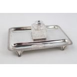 Early 20thC Silver inkstand with gadrooned border supported on four bracket feet, London 1924 by