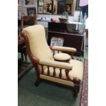 Good quality 19thC Walnut Smokers Chair with turned spindle arms and a upholstered matched Gout