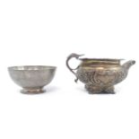 20thC Silver Sugar Bowl London 1959 and a 19thC Silver Foliate decorated water jug (markings rubbed)