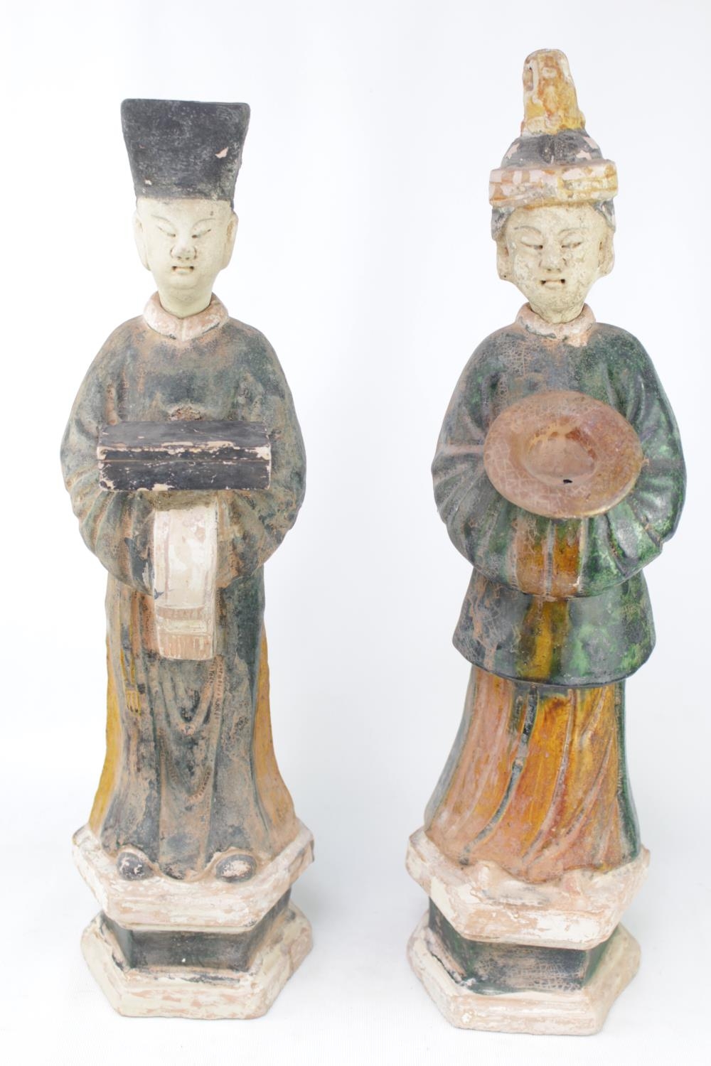 Pair of Antique Chinese green and amber lead-glazed pottery funerary figures in the form of