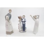 Collection of 3 Lladro figure of a Courting Couple, Woman with Lamb and a Boy waking