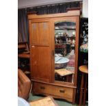 Oak Arts & Crafts Wardrobe with Inlaid Pewter floral panels flanked by hinged mirror over single