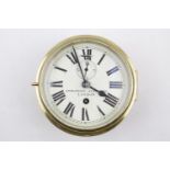 A Mohannsen of 149 Minories London Brass cased Ships Clock with roman dial. 19cm in Diameter. with