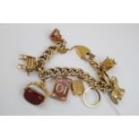 Ladies 9ct Gold Hollow chain bracelet with assorted charms 53g total weight