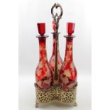 Victorian Silver plated 3 bottle holder with 3 Ruby vine decorated bottles with stoppers. 46cm in