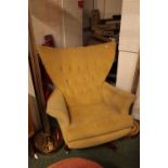 Mid Century Limited Edition G Plan upholstered Elbow chair on swivel base and casters