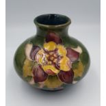 Moorcroft Squat Orchid and Clematis pattern vase with impressed green mark to base. 7cm in Height