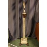 19thC Corinthian Column Oil Lamp base with later electric conversion mounted on paw feet. 146cm in