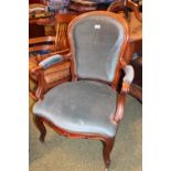 Victorian Mahogany framed Elbow chair with upholstered seat, back and arms. terminating on casters