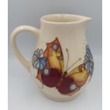 Moorcroft Butterfly & Forget Me Not Cream ground jug dated 1993 with impressed blue mark to base.