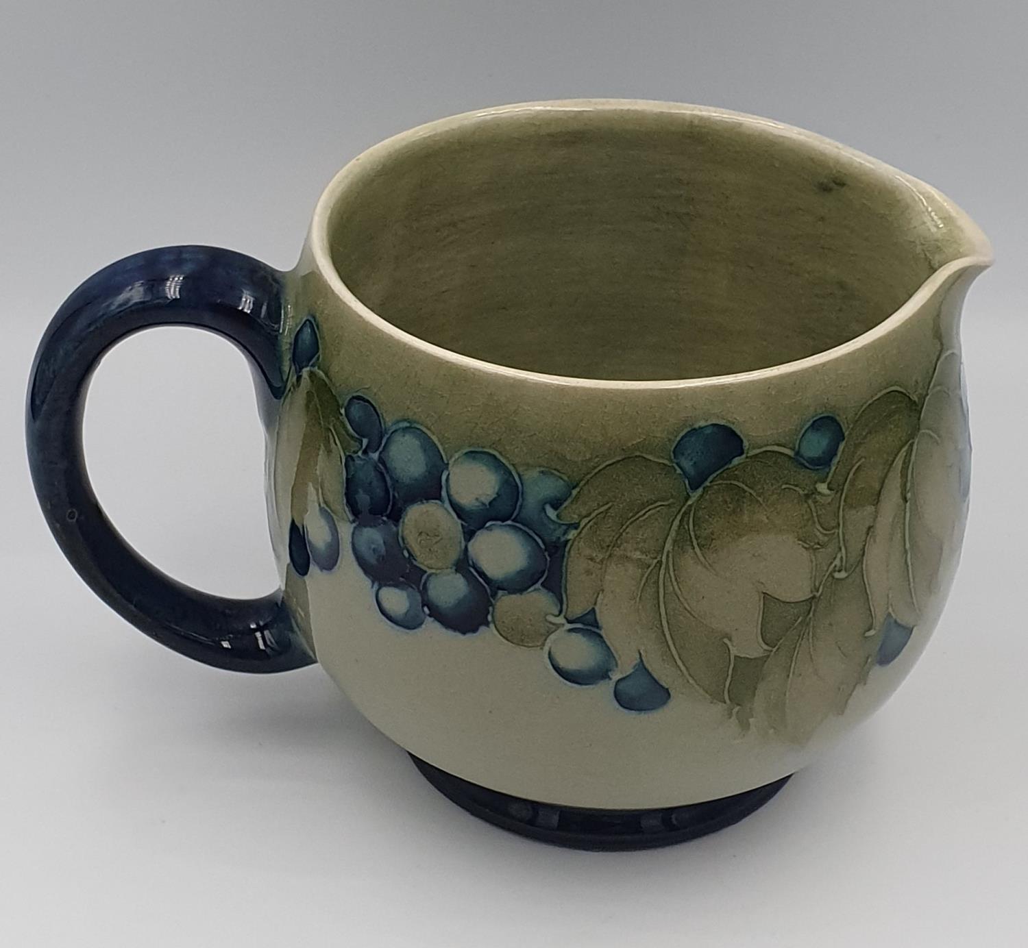 Moorcroft 1930s/40s Leaf and Berries on green ground Jug Signed Walter to base in blue. 7.5cm in