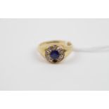 Gents 18ct Gold Signet ring set with 0.75ct Sapphire surrounded by Diamonds. 8.4g total weight (