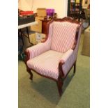 Victorian Mahogany framed Elbow chair with upholstered seat over brass casters