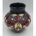 Moorcroft Squat vase with Stylised Orchid Trillium pattern, by Nicola Slaney C.2000.