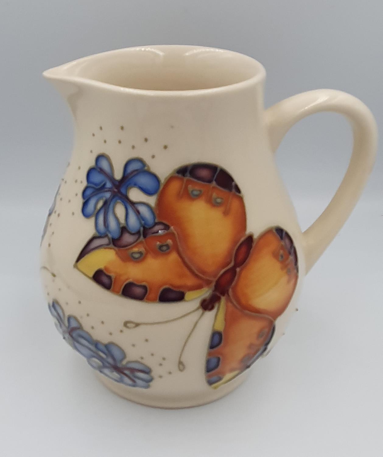 Moorcroft Butterfly & Forget Me Not Cream ground jug dated 1993 with impressed blue mark to base. - Image 2 of 3