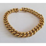 A gold curb link bracelet (marked 18) 18.7g